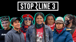 Activists stand beneath a banner that says Stop Line 3