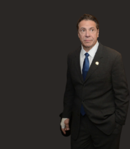 Andrew Cuomo against a black background