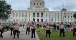 huge numbers of police stand outside minnesota capitol arresting Line 3 activists
