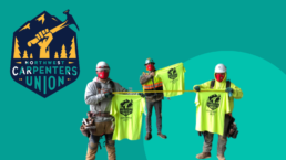 Three carpenters stand against a green background holding strike shirts
