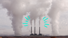 emissions leaving industrial smoke stacks