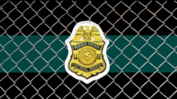 Border patrol logo against a chain link fence background