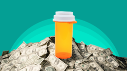 pill bottle on a pile of cash