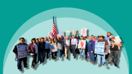 Striking Kellogg's workers hold flags and signs