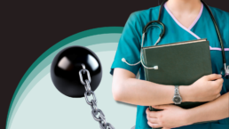 A medical student stands with a ball and chain behind them