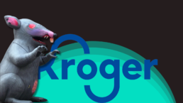 Scabby the inflatable rat menaces the Kroger logo against a black and green background
