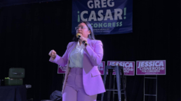Jessica Cisneros speaks on stage at a campaign event