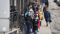 Russians line up outside a bank