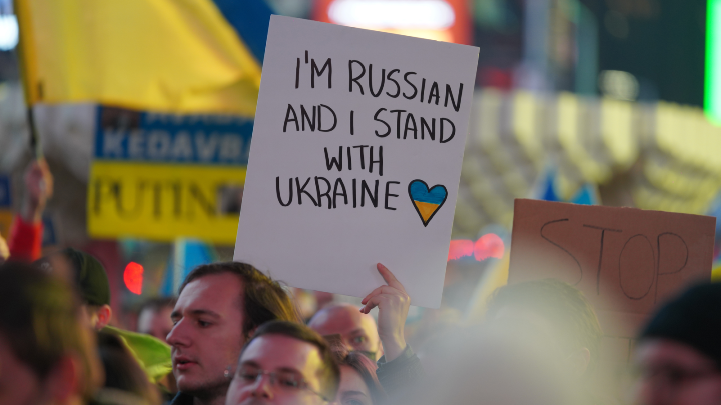 protestor sign russian against putin