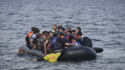 refugees on boat entering Europe
