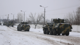 armored vehicles roll by as Ukraine continues to prep for further for Russian forces