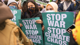 GLASGOW, UNITED KINGDOM - Nov 23, 2021: The three women holding climate change posters saying 