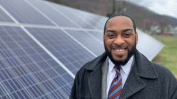 charles booker in front of solar panels in kentucky