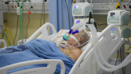covid-19 patient in hospital on breathing machine