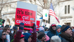 its time to cut carbon sign at climate protest