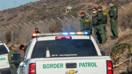 Border Patrol agents and Police detain a suspect on the side of the 5 freeway near Camp Pendleton Ca