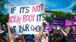 Abortion protests with various pro-choice slogans on display