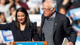 U.S. Representative Alexandria Ocasio-Cortez & U.S. Senator Bernie Sanders on stage at Bernie Sanders Rally 