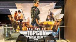 A movie poster for Top Gun: Maverick features Tom Cruise