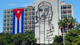 Cuban flag and sculpture of Che Guevara on facade of Ministry of Interior, Plaza de la Revolucion, Havana, Cuba on January 28, 2009, on the 50th anniversay of the revolution.