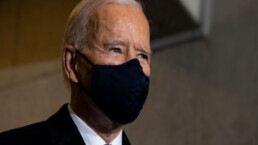 Biden wearing a black mask over most of his face