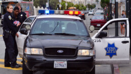 SFPD officers arresting Black American man in San Francisco.
