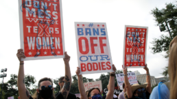 Protestors hold signs at a Texas abortion rights rally