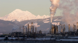 An oil refinery in operation near Mt. Baker in Washington State. This refinery is emitting quantities of steam or other pollutants. Taken near sunset, the refinery is relatively dark and ominous.