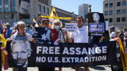 Supporters of WikiLeaks founder Julian Assange take part in a protest against the NATO leaders summit in Brussels, Belgium June 13, 2021