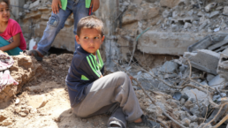 Children play in their destroyed homes' rubble, which were hit by Israeli airstrikes in North Gaza