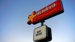 Logansport, Indiana /USA 12-6-2019 isolated Hardee's fast food restaurant sign with 