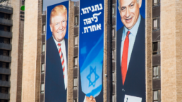 Netanyahu and trump campaign sign on building
