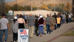 Voters wait in a long line to cast their ballots