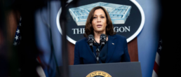 kamala harris in front of pentagon signage