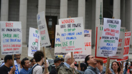 People protesting against the Supreme Court's decision limiting the power of public employee unions in Lower Manhattan.