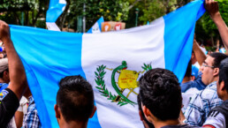 Locals waving Guatemalan flags & slogans protesting against government corruption & demanding resignation of President