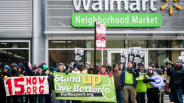 Striking Walmart workers and supporters protest against low wages and charge that Walmart retaliates against employees who push for better working conditions.