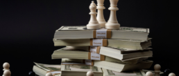 chess pieces and money