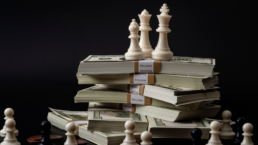 chess pieces and money