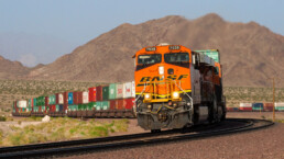 A BNSF Railway intermodal train twists through the Mojave desert.