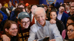Joe Biden takes a selfie with voters during a town hall campaign stop.