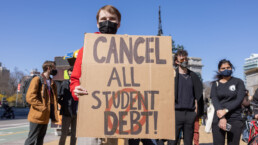 Demonstrators protest near Grand Army Plaza during a rally to cancel student loan debts.
