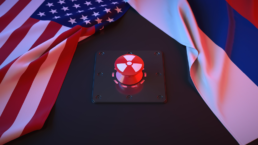 usa and russia flags next to red nuclear button