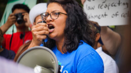 Congressional candidate Rashida Tlaib speaks in protest against the supreme court's ruling on the muslim ban.