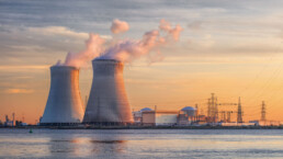 Late afternoon scene with view on riverbank with nuclear reactor