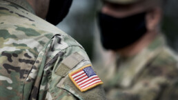 US soldiers wearing protective face masks.