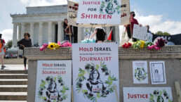 Activists at the 74th Palestinian Nakba commemorated at the Lincoln Memorial hold signs calling for justice in the killing of journalist Shireen Abu Akleh.