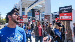 Members of WGA walk with pickets on strike outside the Culver Studio, Tuesday May 2, 2023 in Culver City, California.
