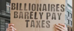 billionaires barely pay taxes sign