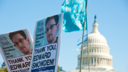 signs in support of edward snowden at rally in DC